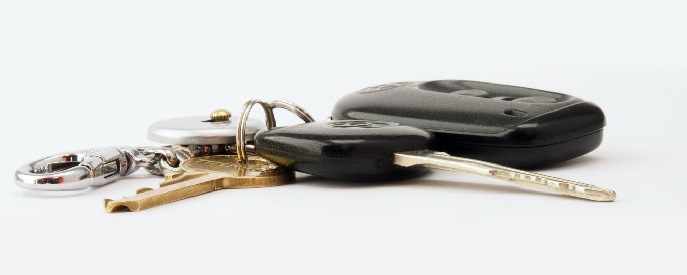 car keys on white surface